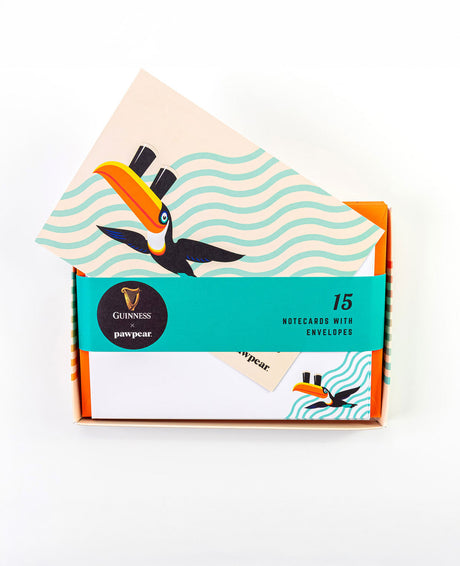 Pack of notecards with envelopes featuring a toucan design on a white background
