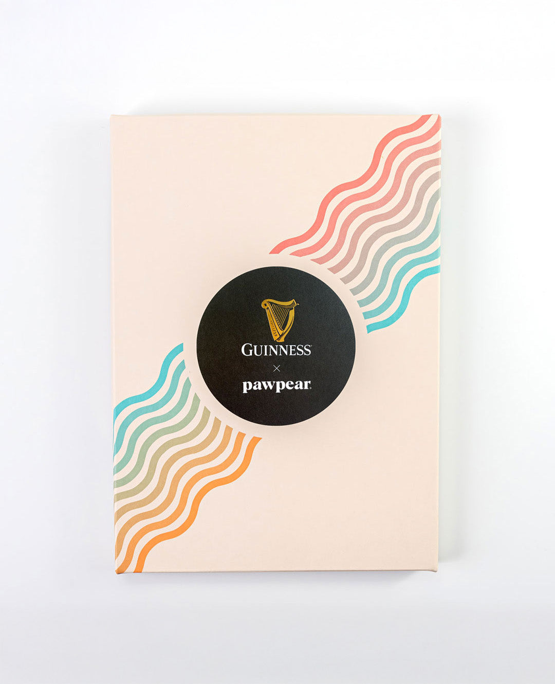 Product packaging with Guinness and pawpear branding on a white background