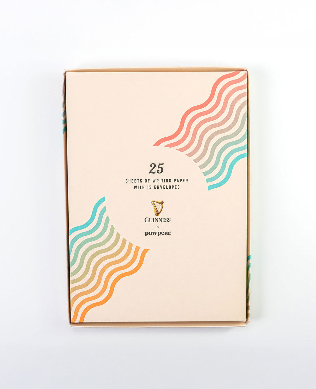 Pack of writing paper with colorful wave design on a white background