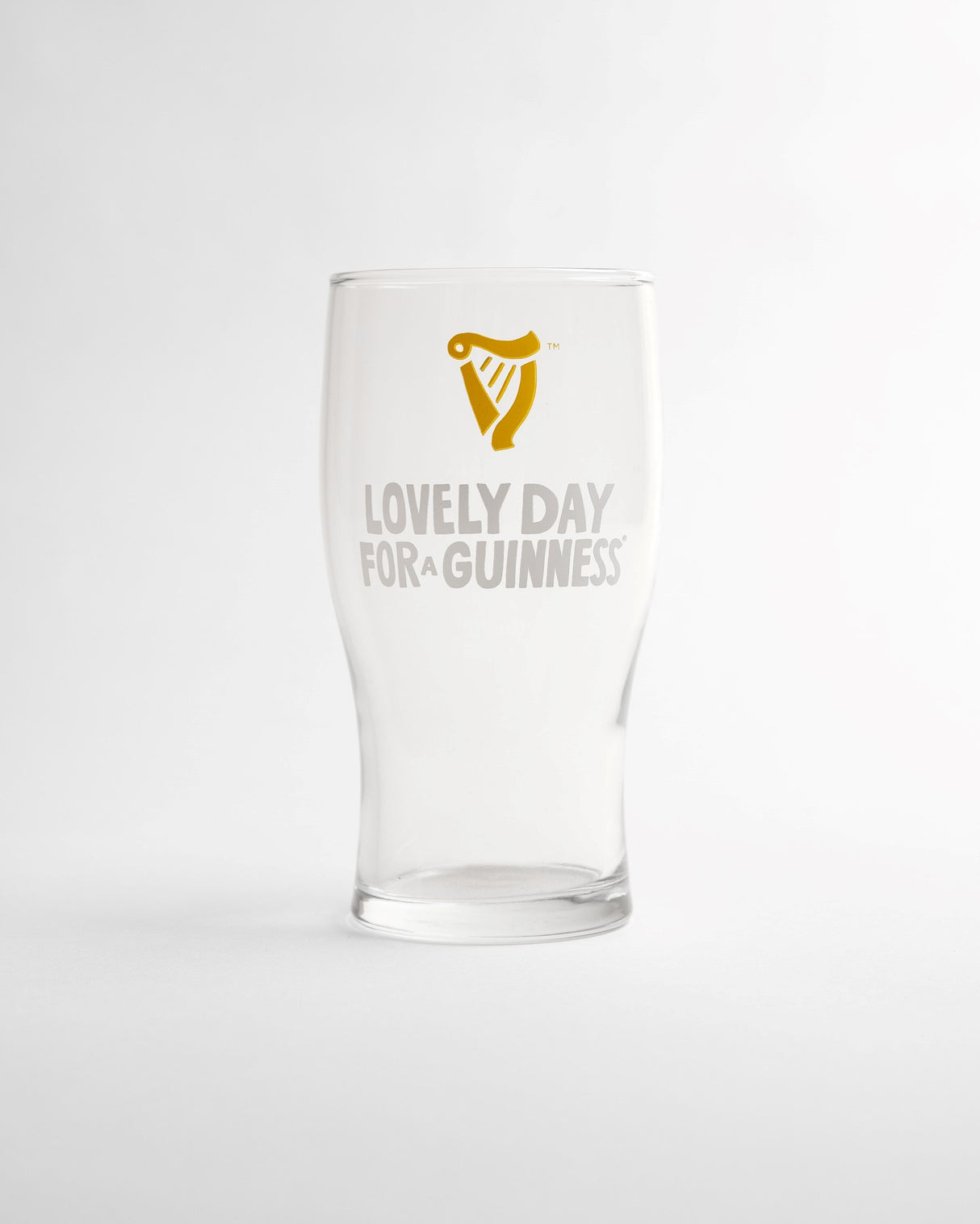 Clear glass with 'Lovely Day for Guinness' text and harp logo on a white background