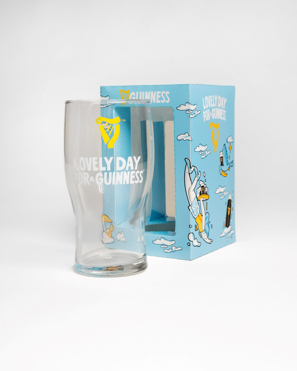 Clear glass with 'Lovely Day' text and blue packaging featuring Guinness branding on a white background.