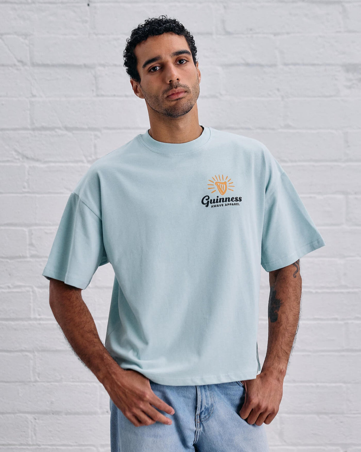 Model wearing the Guinness and Awave Apparel light blue, lovely day, t-shirt.