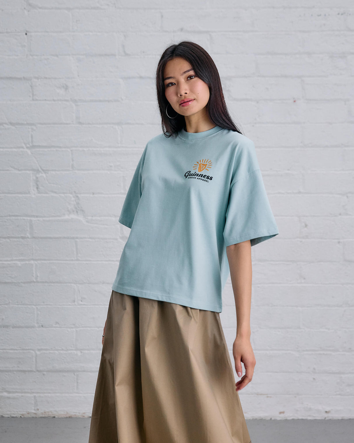 Model wearing the Guinness and Awave Apparel light blue, lovely day, t-shirt.