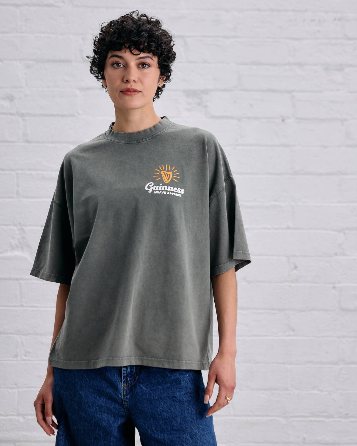 Imagae of a model wearing the Guinness and Awave t-shirt.