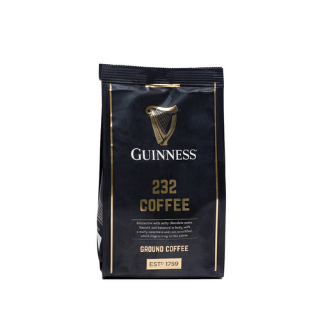 A packaged bag of Guinness 232 ground coffee, predominantly black in color with gold and white text detailing the product name and brand.