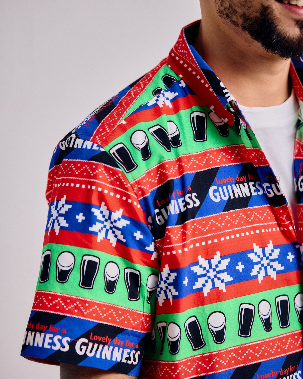 Person wearing a colorful Guinness shirt with patterned design