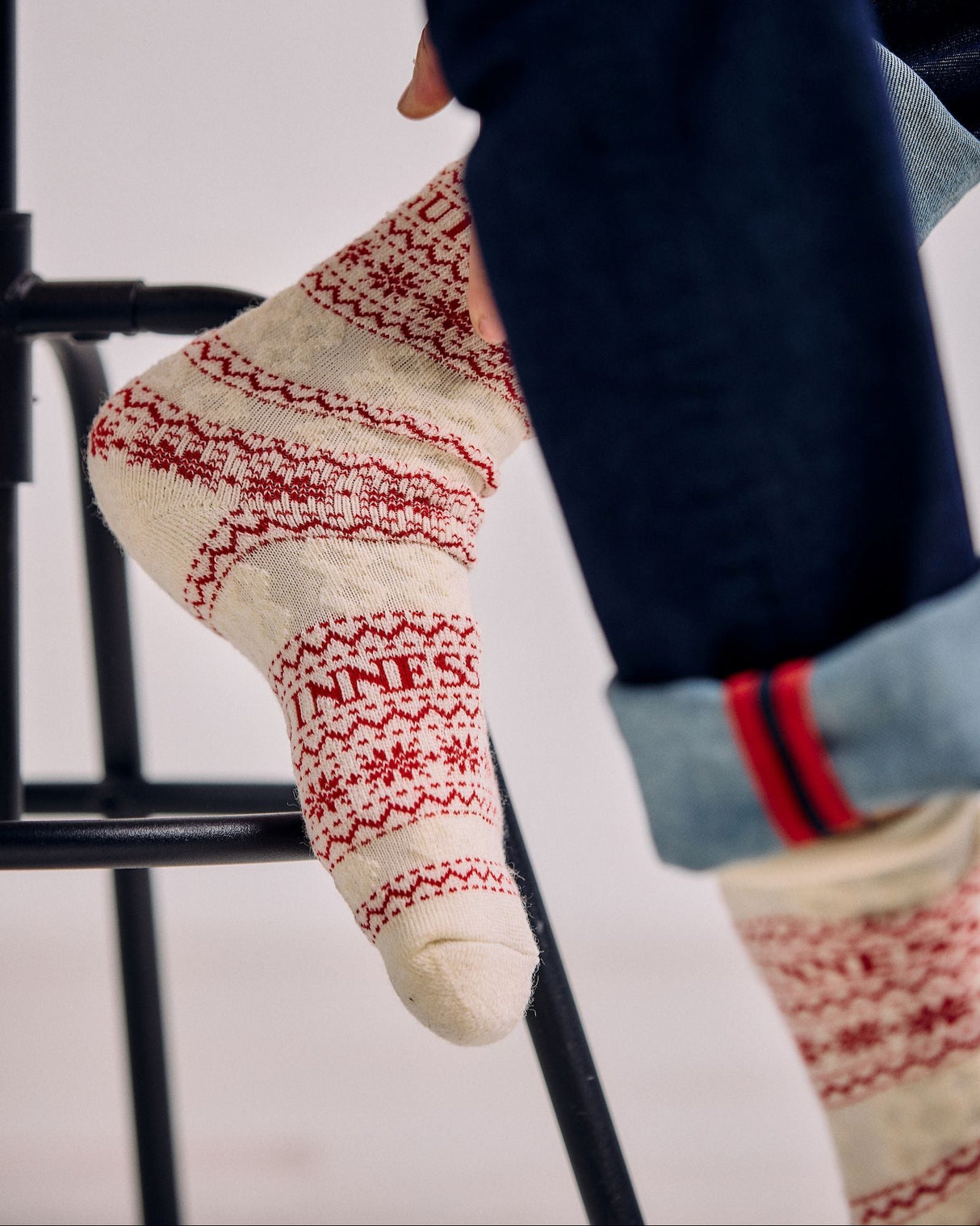 Person wearing patterned socks on a blurred background