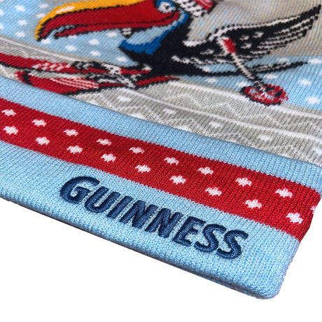 Close-up of a Guinness-themed sock with a toucan design on a white background