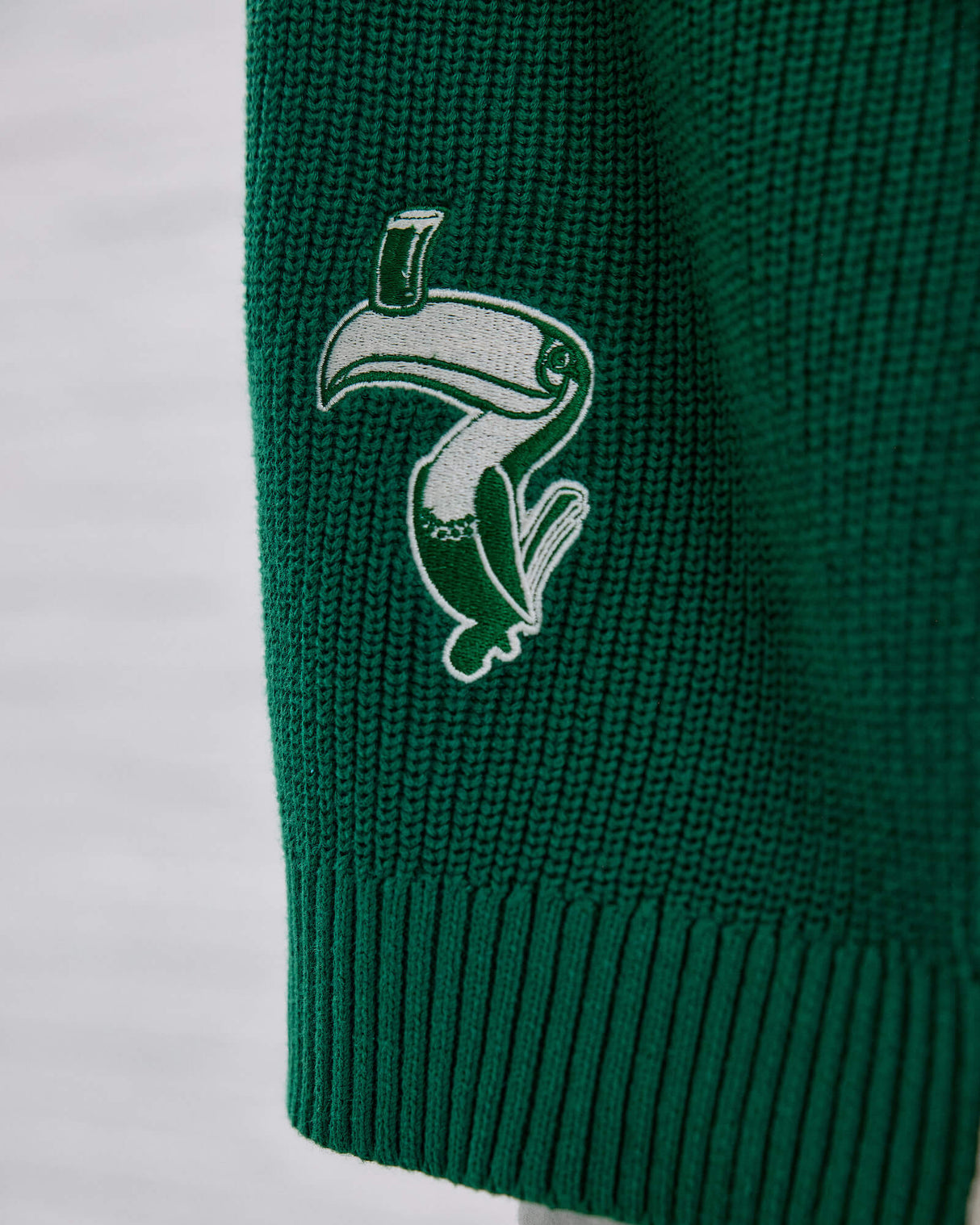 Close up image of the Guinness Ireland Green Cardigan Gilroy toucan.