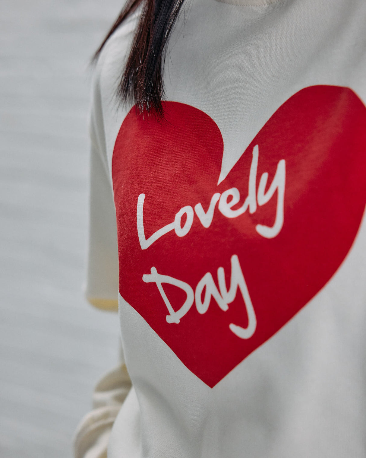 Detail shot the Guinness Storehouse Exclusive white sweater with the lovely day heart.