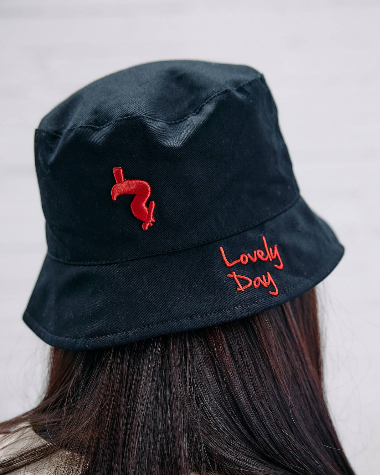 Image of the back of the lovely day black bucket hat.