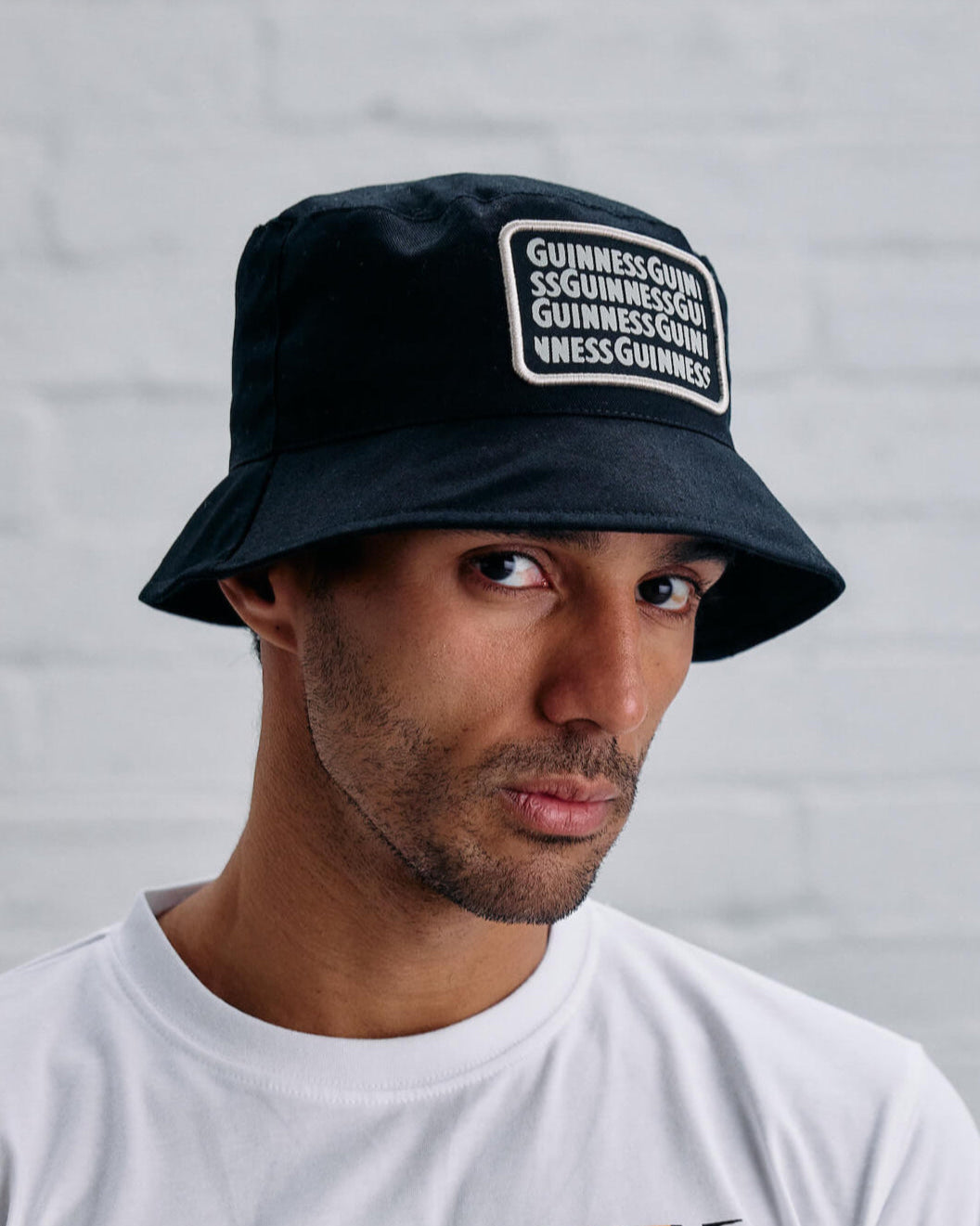 Model wearing the lovely day black bucket hat.