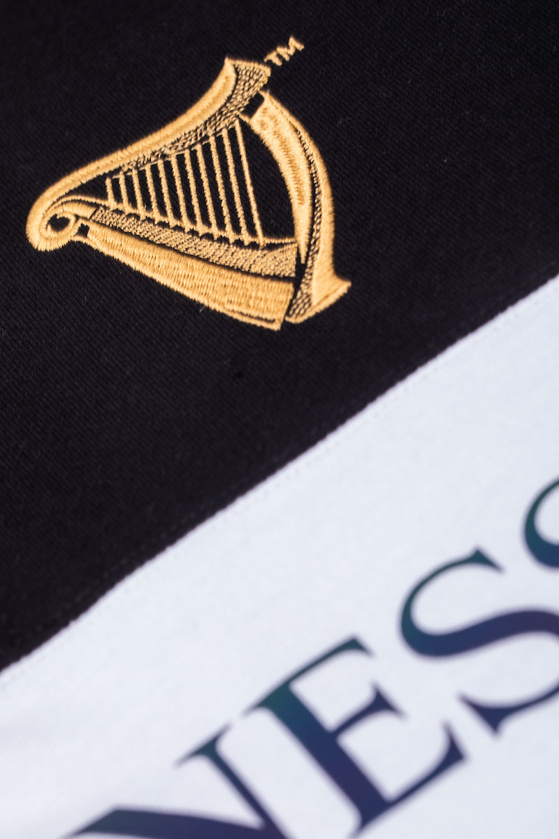 Detail of the Guinness Storheouse Exclusive black, grey and white rugby polo.