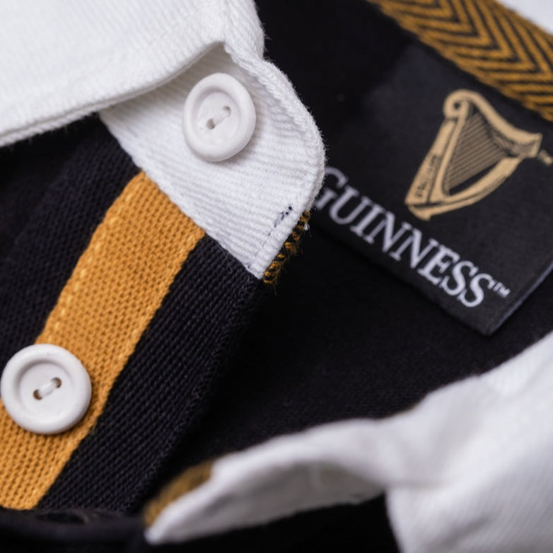 Detail of the Guinness Storehouse Exclusive black, grey and white rugby polo.