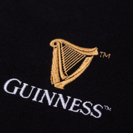 Detail of the Guinness Storehouse Black and White stripes rugby polo logo.