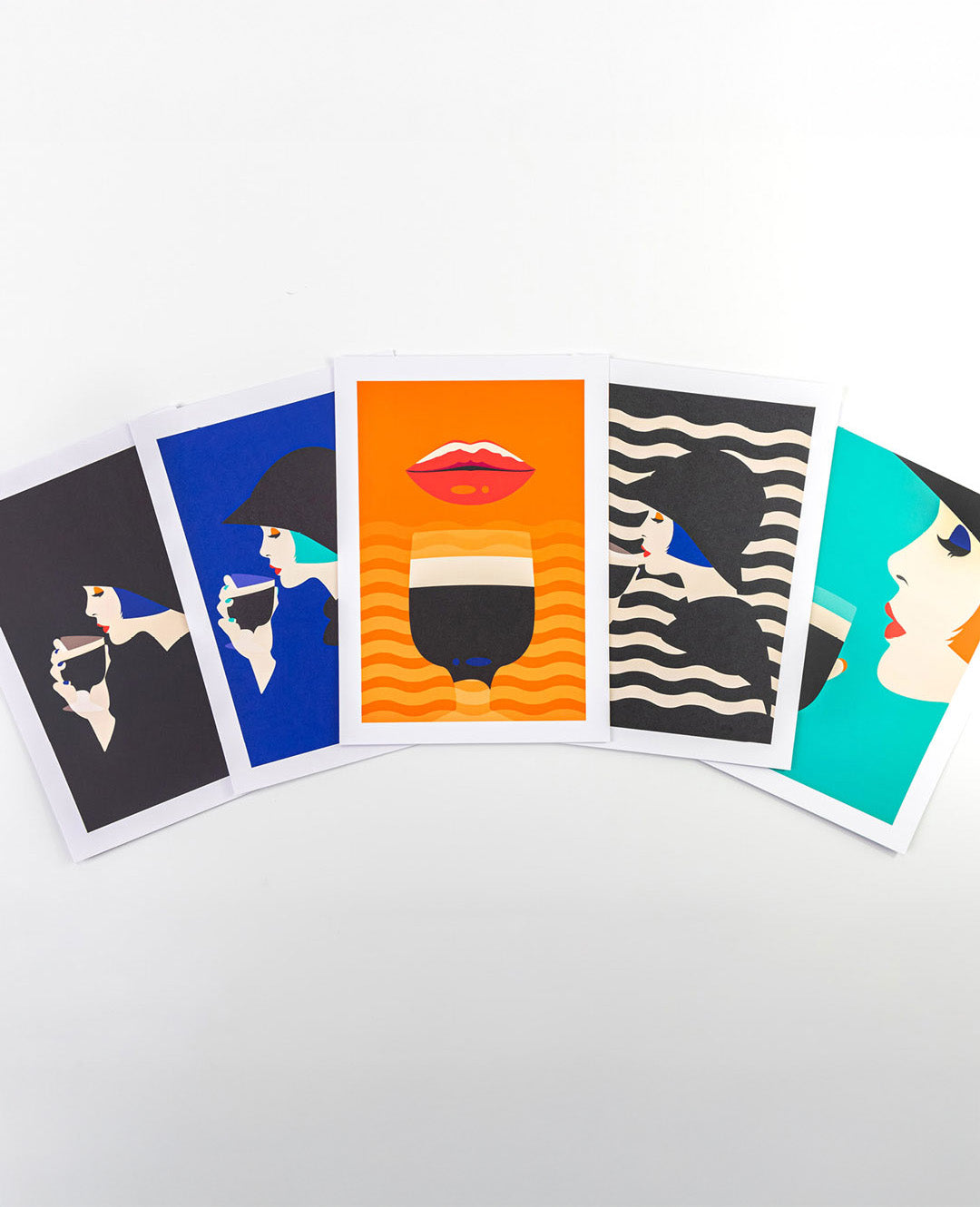 Set of six colorful greeting cards with artistic designs on a white background