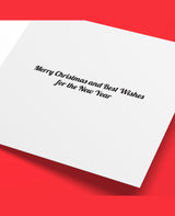 White card with Christmas message on a red background