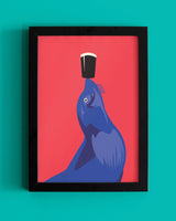 Framed artwork of a blue sealion with a black and white object on its head against a red background