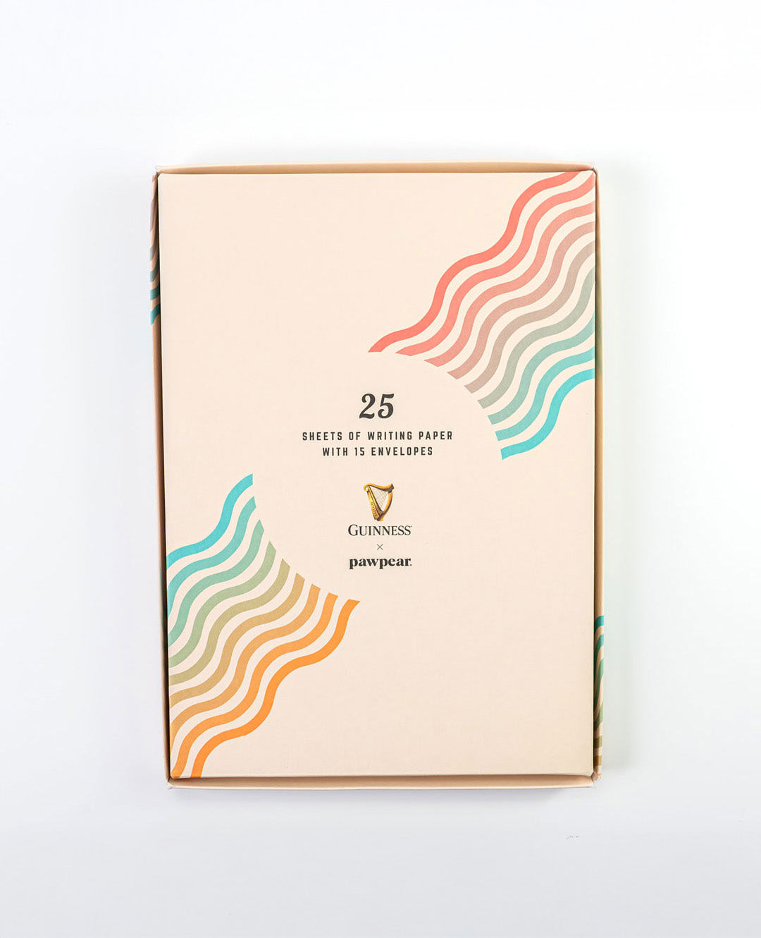 Pack of writing paper with colorful wave design on a white background