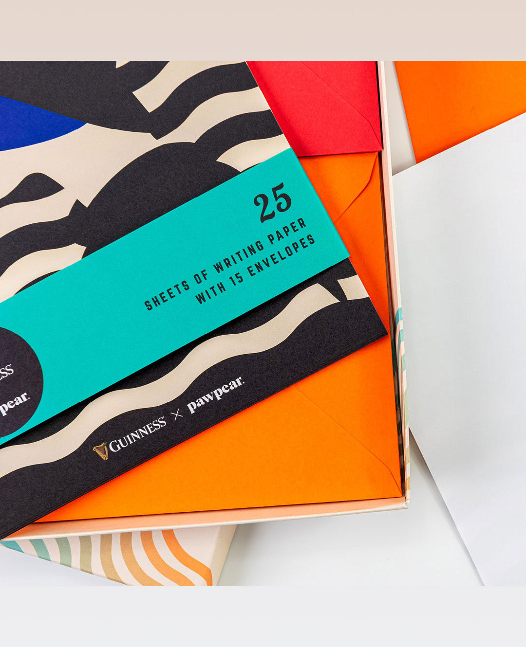 Packaging of writing paper with envelopes featuring Guinness branding.