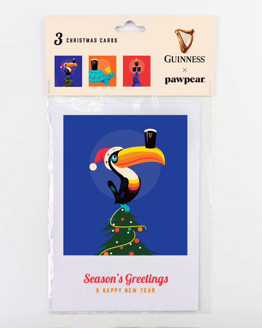 Packaged Christmas cards featuring a toucan with a Guinness beer glass and festive hat, branded by Guinness and pawpear.
