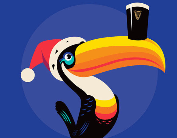Colorful toucan wearing a Santa hat on a Christmas tree against a blue background