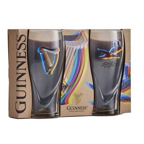 Two limited Edition Guinness glasses with colourful Harp and Toucan design by Aches. 