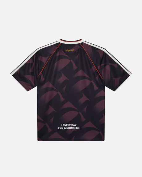 Black t-shirt with geometric pattern and 'Lovely Day for a Guinness' text on a white background