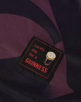 Patch with 'Lovely day for a Guinness' text on a dark fabric background