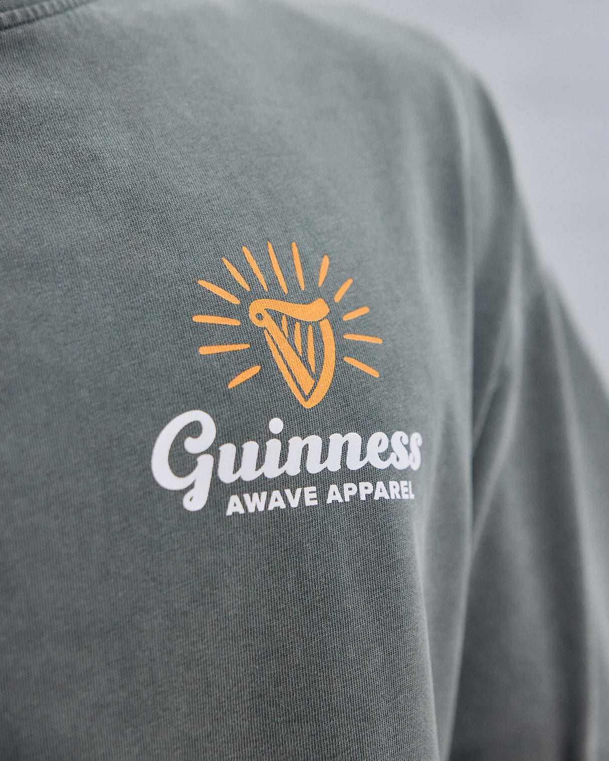 Image of the Awave Apparel and Guinness Logo on the Sage t-shirt