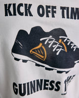 Guinness promotional graphic with a black football boots and text on a white background