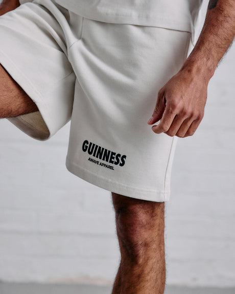 White shorts with 'Guinness' branding on a neutral background