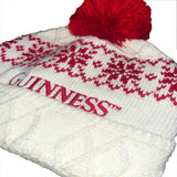 White knit beanie with red pattern and 'Guinness' logo on a white background
