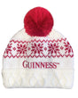 White knit beanie with red pattern and pom-pom, featuring the Guinness logo on a white background.