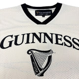 White jersey with black text and harp design, featuring the Guinness logo.
