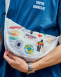 Detail shot of a man wearing the Guinness Storehouse, Dublin, Ireland, exclusive white belt bag.