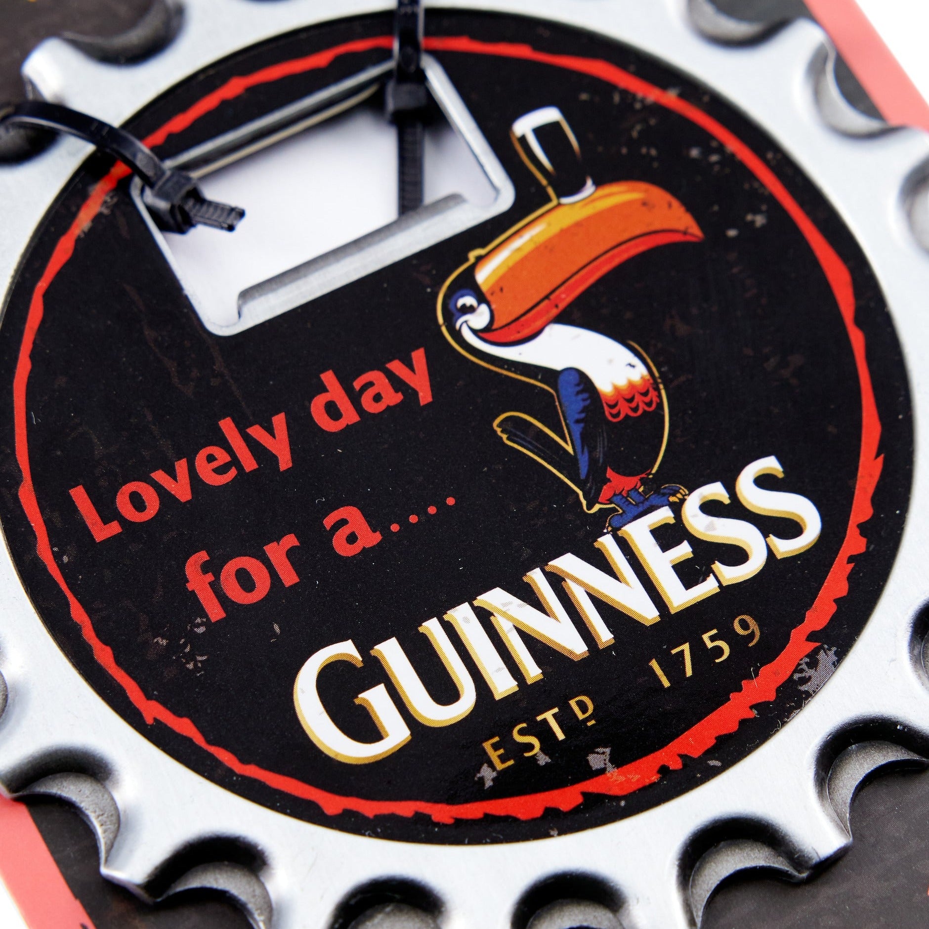 Close up image of the Guinness Toucan 3 in 1 bottle opener 