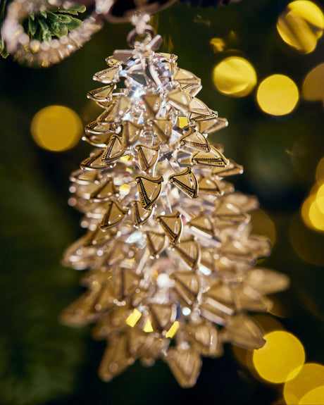 Decorative Christmas tree ornament with a blurred festive background