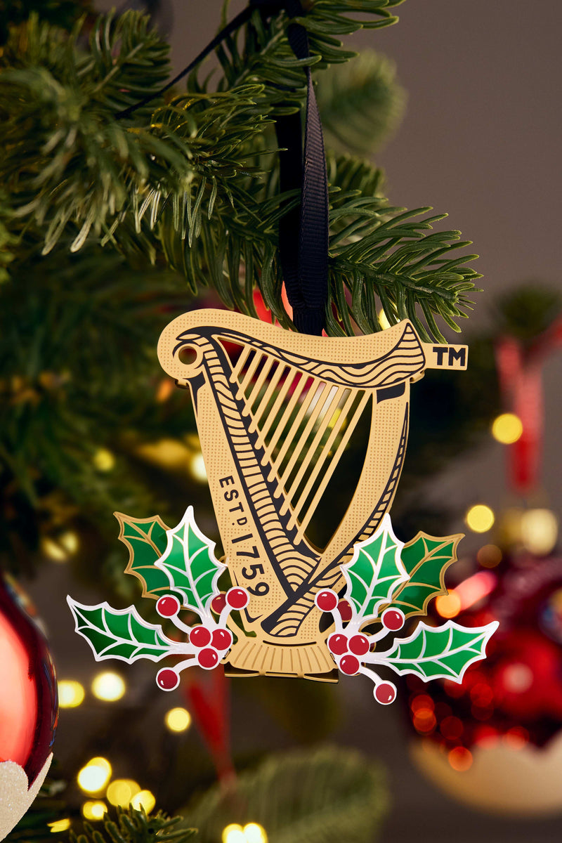 Decorative ornament with a harp design on a Christmas tree.