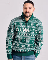 Man wearing a green Guinness sweater with a white background