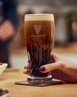 Image of Guinness served in a Guinness x Waterford Lismore Pint Glass