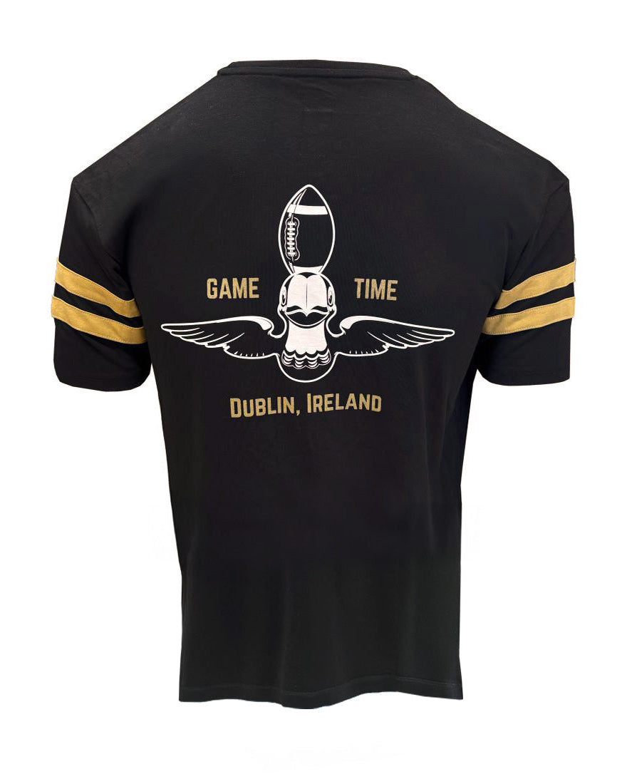 Black t-shirt with gold accents and sports-themed design on a white background