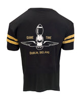 Black t-shirt with gold accents and sports-themed design on a white background