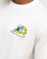 White t-shirt with a colorful graphic of a bird holding a glass bottle on a white background