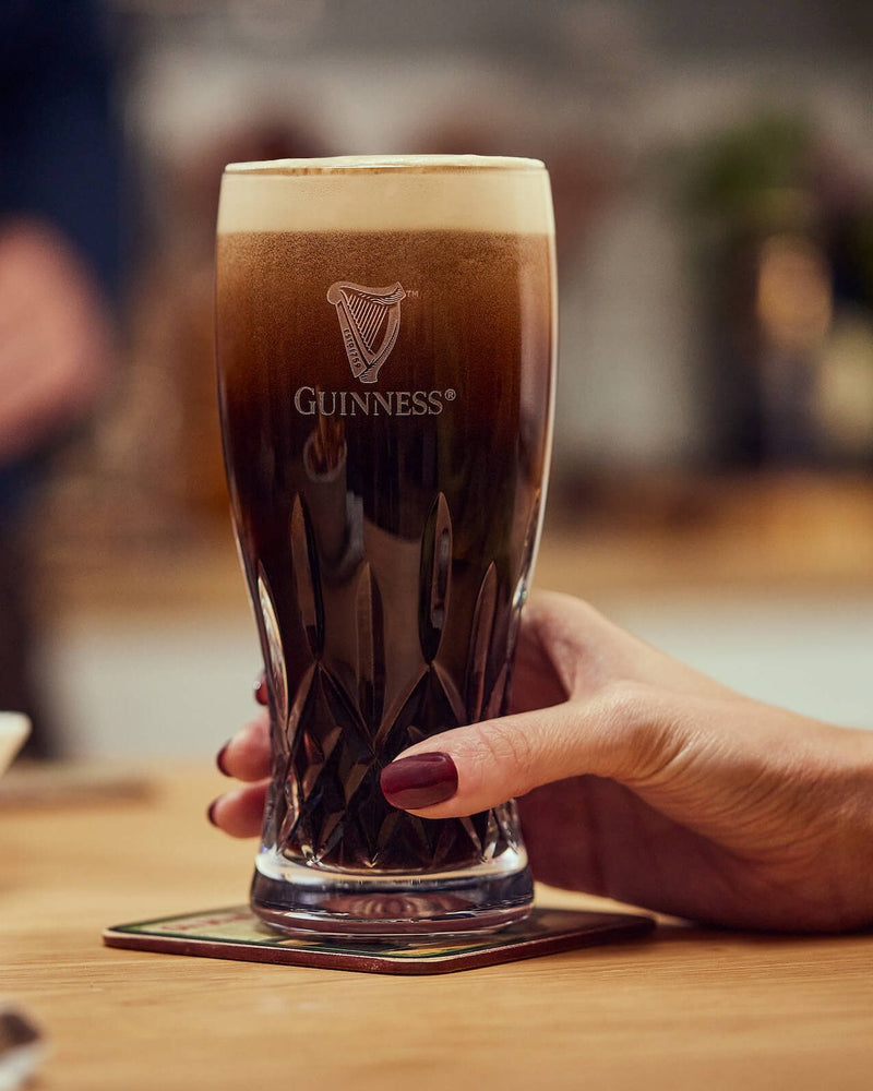 Image of Guinness served in a Guinness x Waterford Lismore Pint Glass