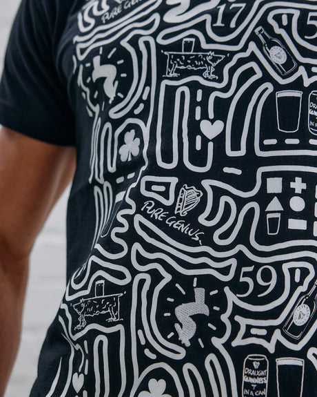 Detail shot of the Guinness Storehouse Exclusive black t-shirt with stylized Dublin map.