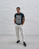 Model wearing the Guinness Storehouse Exclusive black t-shirt with stylized Dublin map.