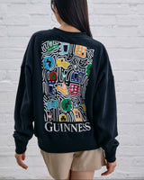Model wearing the Guinness Storehouse Exclusive Black Sweter with stylized Dublin map.