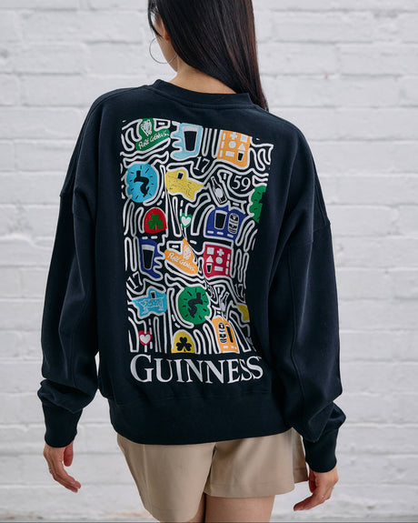 Model wearing the Guinness Storehouse Exclusive Black Sweter with stylized Dublin map.