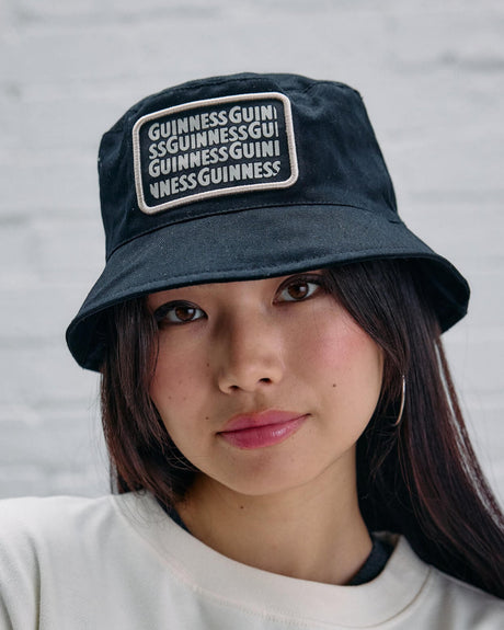 Model wearing the lovely day black bucket hat.